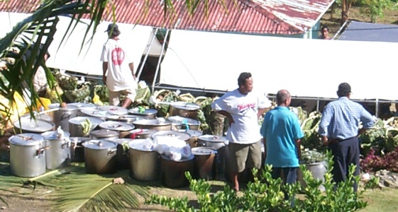 The number of pots increased as more people brought soup pots to the funeral.  Each pot has a thick soup of pig and rice.  Basically each pot represents one pig brought to the funeral. Sort of.