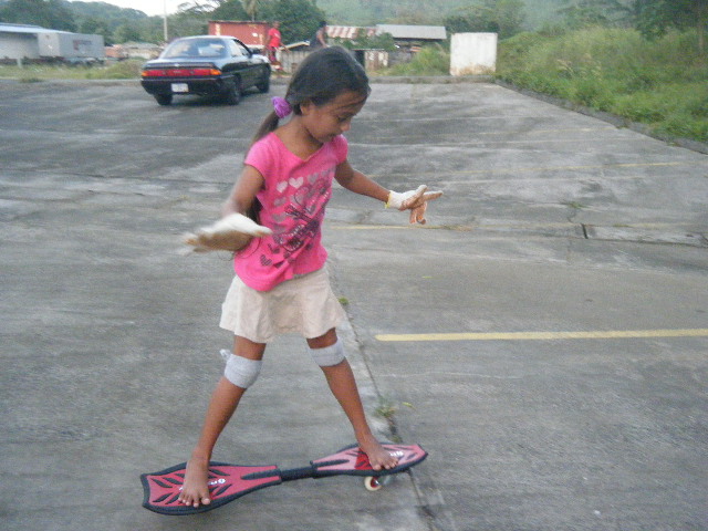 Girl learning to ride a RipStik
