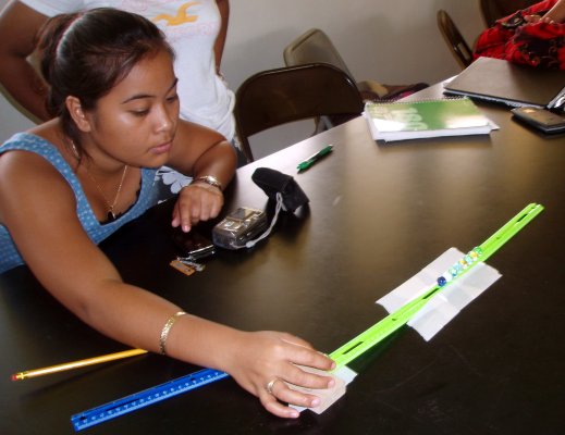 Renee observes the effect of a single marble on the line of marbles.