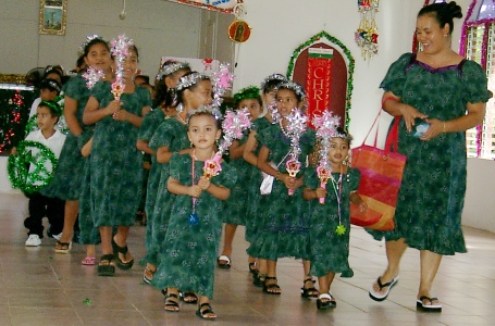 The children's choir marches out of the church.