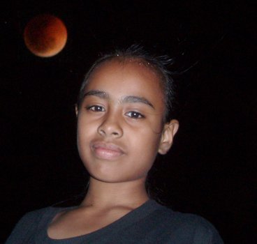 By magnifying the moon and compositing the image with that of my daughter, a much more emotive image results.