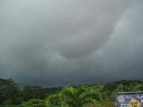 downward billow of cloud in front of the rain