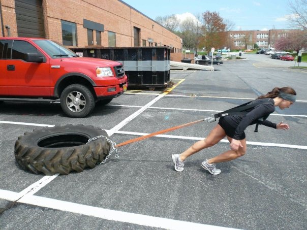 tire being pulled by a rope at an angle