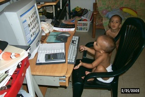 Sixteen month old baby using a computer.